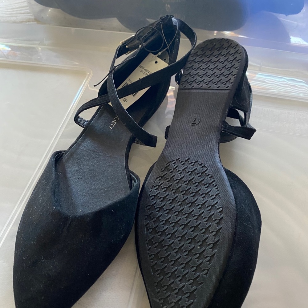 Black strapped flats